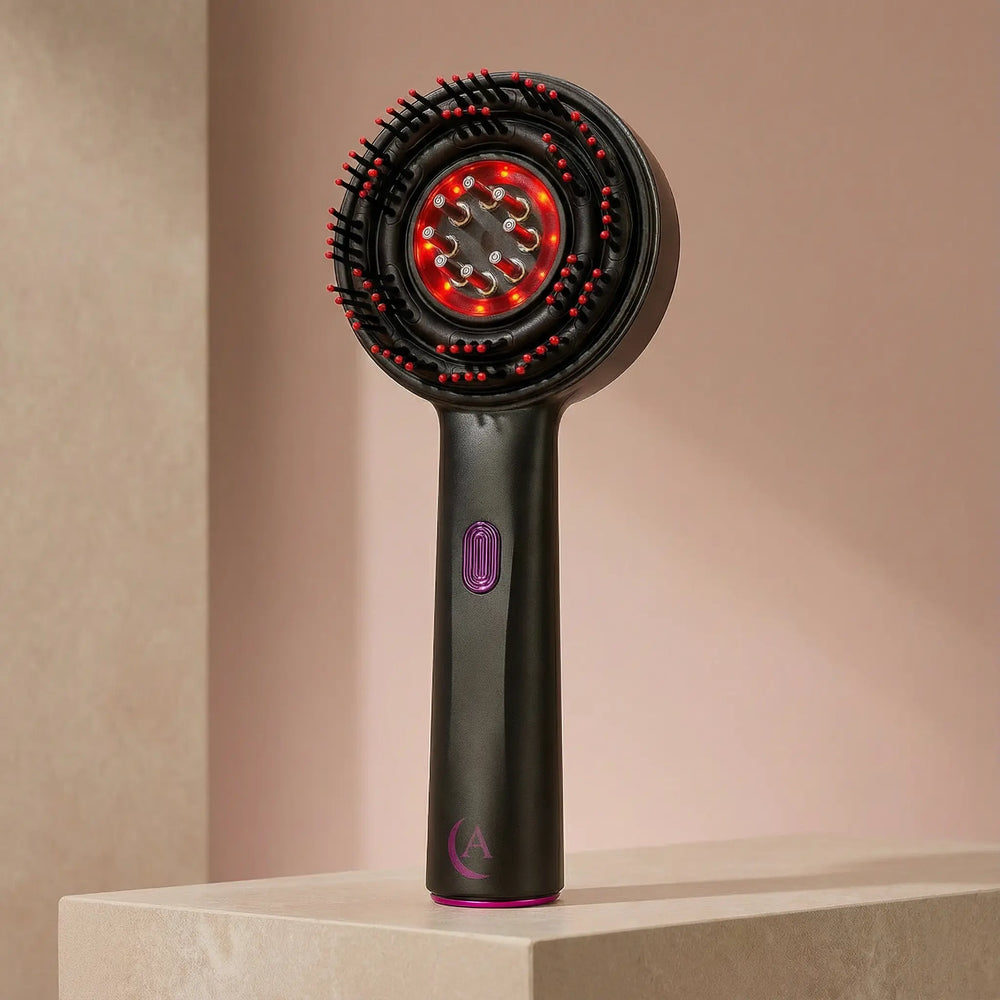 Black and magenta Solivine scalp massager in a beige background